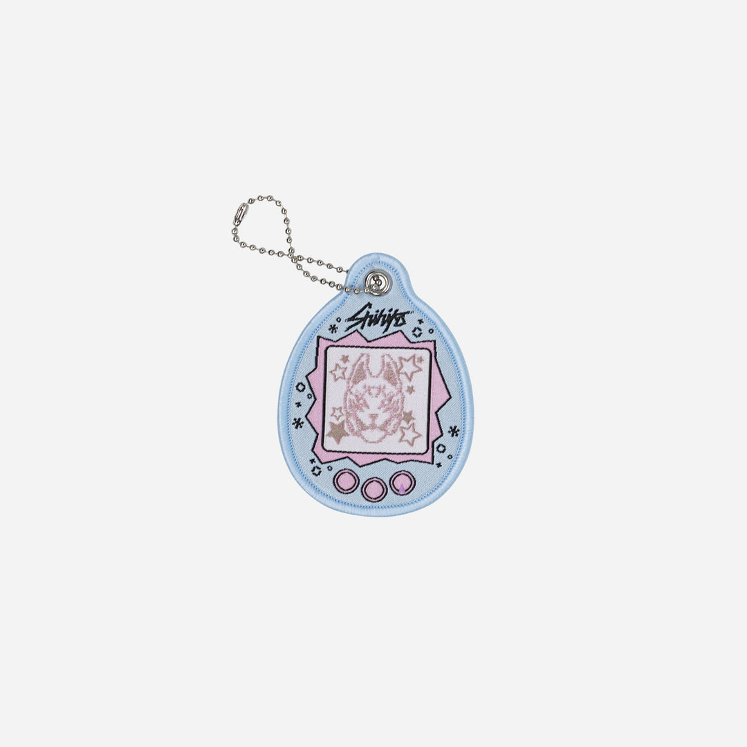 Clocked Out Tamagotchi Flight Tag